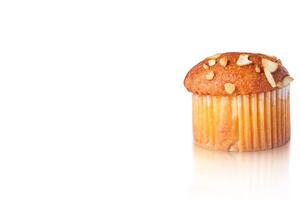 Almond muffin with reflection isolated on white background. Closeup photo