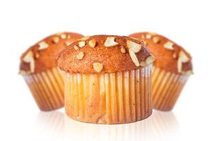 Set of almond muffin with reflection isolated on white background. Closeup photo