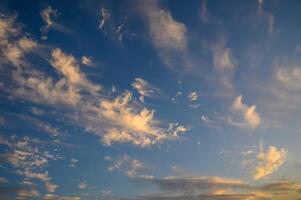 Colourful sunset sky. Full frame view of wispy colourful clouds up in the sky during sunrise or sunset hour 2 photo