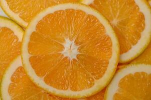 Sliced orange circles, laid on the surface in several layers. Tropical background for design and web 1 photo