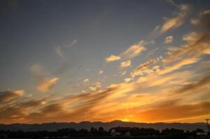 Colourful sunset sky. Full frame view of wispy colourful clouds up in the sky during sunrise or sunset hour 1 photo