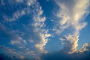 The gathering clouds during sunset create abstract painting patterns in the western sky. 3 photo