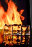 cubes of ice and fire on a water surface on an abstract background 2 photo