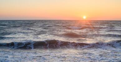 Beautiful view of the orange sunset over the island of Cyprus in the Mediterranean Sea. 1 photo