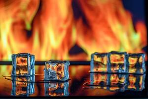 three ice cubes against the background of fire, fire and ice, place under the text 3 photo
