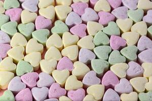 Top view of colorful jelly hearts shaped for background photo