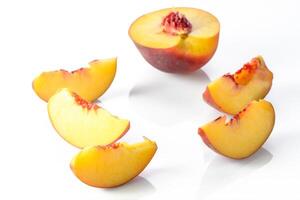 ripe nectarine with leaves isolated on white background. Top view. Flat lay pattern 1 photo