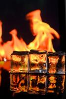 cubes of ice and fire on a water surface on an abstract background 1 photo