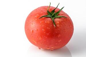 One tomato isolated on white background. Fresh red tomato with clipping path photo