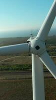 Top view of windmill on horizon background. Shot. Beautiful landscape with windmill at dawn. Modern wind turbine on background of summer landscape video