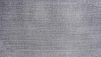 Grey color denim jeans fabric texture. Horizontal or vertical light gray denim background photo