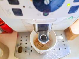coffee machine. Process of preparation of an espresso. Photo on long exposure.