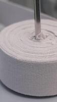 An intricate perspective displays a machine efficiently slicing through a fabric roll video