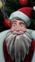 Bad Santa concept. Design. Close up of an abstract Santa Claus smoking cigarette on the background of falling snow and Christmas tree with toys. video