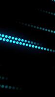 Stream of glowing lines from dots. Motion. Bright stream of binary neon lines on black background. Beautiful neon stream of dot digital lines video