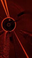 Moving inside abstract dark sewer tunnel with dirty flowing waste water and pipes. Design. View inside of a long dark tunnel with dim lighting. video