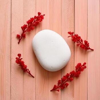 background for product display with a white stone, top view light brown wooden table surface photo