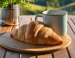 croissant and a cup of coffee photo