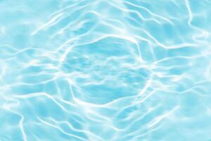 Bluewater waves on the surface ripples blurred. Defocus blurred transparent blue colored clear calm water surface texture with splash and bubbles. Water waves with shining pattern texture background. photo