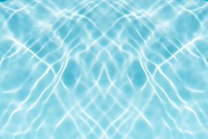 Blue water with ripples on the surface. Defocus blurred transparent blue colored clear calm water surface texture with splashes and bubbles. Water waves with shining pattern texture background. photo