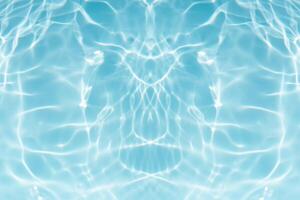 Bluewater waves on the surface ripples blurred. Defocus blurred transparent blue colored clear calm water surface texture with splash and bubbles. Water waves with shining pattern texture background. photo