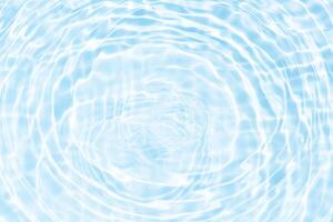 Bluewater waves on the surface ripples blurred. Defocus blurred transparent blue colored clear calm water surface texture with splash and bubbles. Water waves with shining pattern texture background. photo