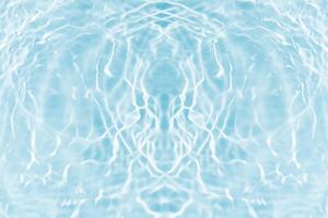 Bluewater waves on the surface ripples blurred. Defocus blurred transparent blue colored clear calm water surface texture with splash and bubbles. Water waves with shining pattern texture background. photo