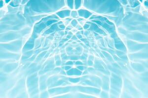 Blue sea waves on the surface ripples blurred. Defocus blurred transparent blue colored clear calm water surface texture with splash and bubbles. Water waves with shining pattern texture background. photo