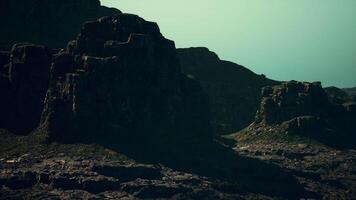 A large rock formation in the middle of a mountain range video