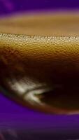 Close-up of dark drink with bubbles. Stock clip. Dark bar drink on isolated background. Alcoholic drink with foam in bar video