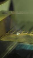 Close-up of burning laser machine at factory. Media. Laser that burns out dots on metal object. Laser burning machine at factory video