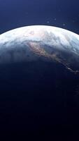 Blue backlight with a view of the ground. Motion.Abstraction on the crust you can see a view of the cosmos and the planet earth, which rotates around its axis and the stars are visible around. video