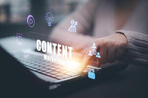 A businesswoman is using a laptop to create marketing content.Creating marketing strategies involves sharing information to attract customer interest.Online marketing and digital marketing. photo