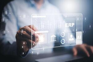 Business people using a laptop with document management for ERP. Enterprise resource planning concept,Enterprise Resource Management ERP software system for business resources plan presented. photo