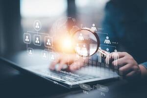 businessman using laptop with Personal information file storage concept ,HR checklists of employees Corporate data management system and document management system with employee privacy. photo