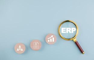 Business people using a laptop with document management for ERP. Enterprise resource planning concept,Enterprise Resource Management ERP software system for business resources plan presented. photo