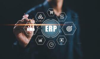 Business people using a laptop with document management for ERP. Enterprise resource planning concept,Enterprise Resource Management ERP software system for business resources plan presented. photo