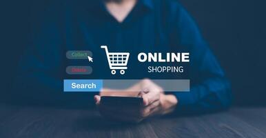 Businessman hold smartphone with online shopping concept, marketplace website with virtual interface of online Shopping cart part of the network, Online shopping business with selecting shopping cart. photo