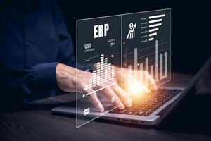 Business people using a laptop with document management for ERP. Enterprise resource planning concept,Enterprise Resource Management ERP software system for business resources plan presented. photo