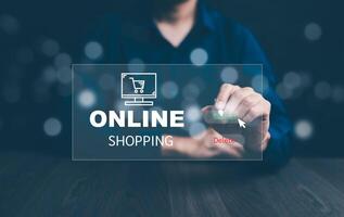 Businessman hold smartphone with online shopping concept, marketplace website with virtual interface of online Shopping cart part of the network, Online shopping business with selecting shopping cart. photo