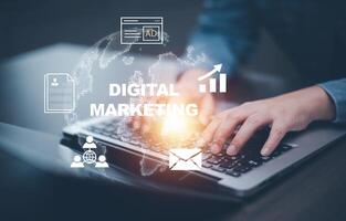 A businessman is using a laptop to create digital marketing content.Creating marketing strategies involves sharing information to attract customer interest.Online marketing and digital marketing. photo