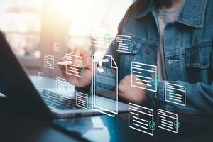 businessman using laptop with Personal information file storage concept ,HR checklists of employees Corporate data management system and document management system with employee privacy. photo
