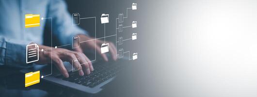 Hand using laptop and touch folder of document Management System, online documentation database and process automation to efficiently manage files work, knowledge, Corporate business technology, photo