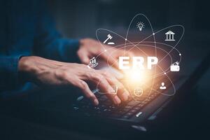 Business people using a laptop with document management for ERP. Enterprise resource planning concept,Enterprise Resource Management ERP software system for business resources plan presented. photo
