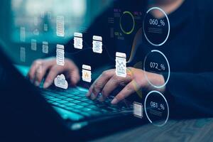 Businessman using a laptop with Analytics and Data Management Systems Analyst working in Business Analytics and Data Management Systems to make reports and corporate strategy for finance, operations photo