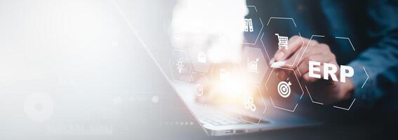 Business people using a laptop with document management for ERP. Enterprise resource planning concept,Enterprise Resource Management ERP software system for business resources plan presented. photo