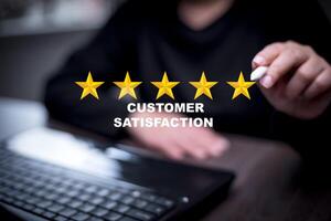 Man touch smartphone with Customer review satisfaction feedback survey concept, User give rating to service experience on online application, service leading to reputation ranking of business. photo