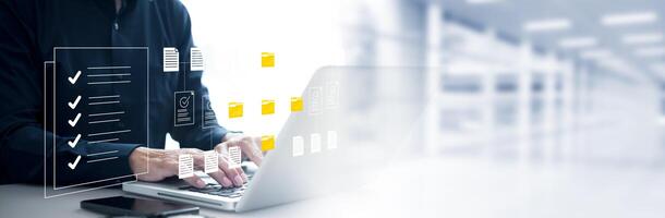Man wearing touch icon folder. Online documentation database, IT consultant being set up Virtual Document Management System with laptop,Software for archiving corporate files. photo