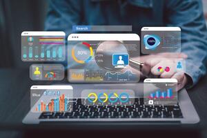 Businessman using a laptop with Analytics and Data Management Systems Analyst working in Business Analytics and Data Management Systems to make reports and corporate strategy for finance, operations photo