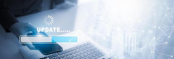 Man using laptop with Update Software Computer Program Upgrade Business Technology Internet, Update on virtual screen. Internet and technology concept, loading bar with installing the update. photo